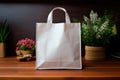 Empty brown paper carrier bag with shopping handles on the table. Mockup for logo application