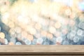 Empty brown wood table top with blur sparkling soft pastel blue and orange bokeh abstract background,panoramic banner for display