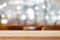 Empty brown wooden table and blur background of resturant, can be used for montage or display your products Royalty Free Stock Photo