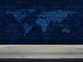 Empty brown wooden table top over world map and computer binary Royalty Free Stock Photo