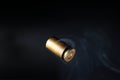 Empty bullet shell casings, on a black background, smoke Royalty Free Stock Photo