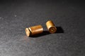 Empty bullet shell casings, on a black background, smoke Royalty Free Stock Photo