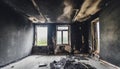 Empty burned room with window. Damaged apartment after house fire, charred walls and ceiling