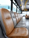 Empty bus seats in a modern interior, focus on leather seats. Royalty Free Stock Photo