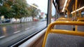 Empty bus seats with a rainy street view through the window. Royalty Free Stock Photo