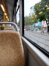 Empty bus seats with a view of the city street outside. Royalty Free Stock Photo