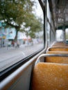 Empty bus seats with a view of the street outside. Royalty Free Stock Photo