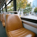 Empty bus seats with a view of an urban street outside. Royalty Free Stock Photo
