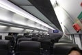 An empty cabin of the aeroexpress train without passengers. Soft seats in a row with leather headrests. Public place. Selective fo Royalty Free Stock Photo