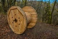 An empty cable reel is left on site. The problem of ecology Royalty Free Stock Photo