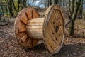 An empty cable reel is left on site. The problem of ecology Royalty Free Stock Photo