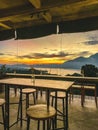 Empty cafe on sunrise with view on Batur volcano