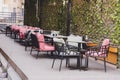 Empty cafe terrace with tables and chairs. Exterior of cafe restaurant. Interior cozy Street cafe . Decor facade of