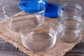 Empty canning jars await use on a wooden table Royalty Free Stock Photo