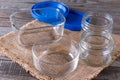 Empty canning jars await use on a wooden table Royalty Free Stock Photo