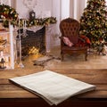 Empty canvas napkin on wooden desk top view. Festive sparkling Christmas interiors background