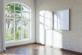 empty canvas poster mock up hanging on a wall empty living room interior bright daylight shining through a large window home