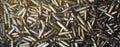 Empty carbine or rifle cartridges. A large number of cases. Background of brass ammunition cartridges to illustrate armed conflict Royalty Free Stock Photo