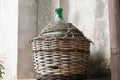 Empty carboy in rustic house