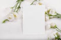 empty card mockup with blooming white eustoma lisianthus flowers