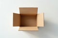 Empty cardboard box sits open on a clean white surface under bright daylight. Ready for packing shipping moving storage office Royalty Free Stock Photo