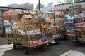 Empty cardboard boxes of bananas and tropical fruits are stacked on the street near the market. Concept export import of bananas