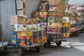 Empty cardboard boxes of bananas and tropical fruits are stacked on the street near the market. Concept export import of bananas