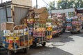 Empty cardboard boxes of bananas and tropical fruits are stacked on the street near the market. Concept export import of bananas