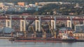 Empty cargo ship waiting for loading in port aerial timelapse. Lots of cranes and containers in background. Lisbon Royalty Free Stock Photo