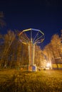 Empty carousel caps in a night amusement park