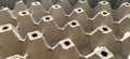 Empty carton for chicken eggs. A container for transporting and carrying fragile bird eggs. Container for packaging food. Lots of Royalty Free Stock Photo
