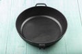 Empty cast iron skillet frying pan on wood background Royalty Free Stock Photo