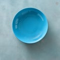 Empty ceramic blue round plate stone background top view flat lay