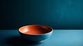 Empty ceramic bowl on blue background. Copy space for your text.