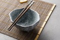 Empty ceramic bowl and chopsticks. Asian lunch table setting Royalty Free Stock Photo