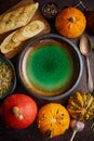 Empty ceramic bowl and ingredients ready for pumpkin soup. With different kinds of small pumpkins Royalty Free Stock Photo