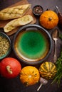 Empty ceramic bowl and ingredients ready for pumpkin soup. With different kinds of small pumpkins Royalty Free Stock Photo