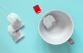 Empty ceramic cup with paper tea bags Royalty Free Stock Photo
