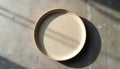 Empty ceramic dish plate on textured surface. Rustic tableware, minimalism, kitchen design, home decor. Top view of dish, food Royalty Free Stock Photo