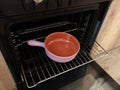 Empty ceramic pan with one handle, pot baking dish for roasting food in oven on rack. Traditional national cookware Royalty Free Stock Photo
