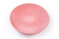 Empty ceramic pink plate on a white background