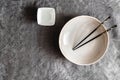 Empty ceramic plate and black chopsticks. Japanese cuisine Royalty Free Stock Photo