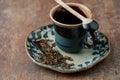 Empty Ceramic Tea Cup and Green Tea Leaves. Symbolic image. Asian culture.