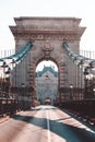 Empty Chain Bridge in Budapest is a historical architecture, famous for tourism, without any transport, with a kings emblem, natio