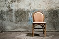 Empty chair and grungy wall