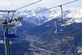 Chairlifts over Susa Valley and snowy mountain peaks in Piedmont, Turin, Italy Royalty Free Stock Photo