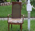 Empty chair next to mailbox in subrurbia