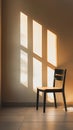 An empty chair in a quiet, sunlit room with a single window. Clean, The frame is dominated by the simplicity and abstract geometry Royalty Free Stock Photo