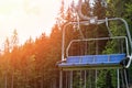 Empty chair ski lift in the summer. Vacation in the mountains ecotourism