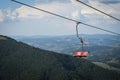 Empty chairlift on a background of beautiful autumn mountains Royalty Free Stock Photo